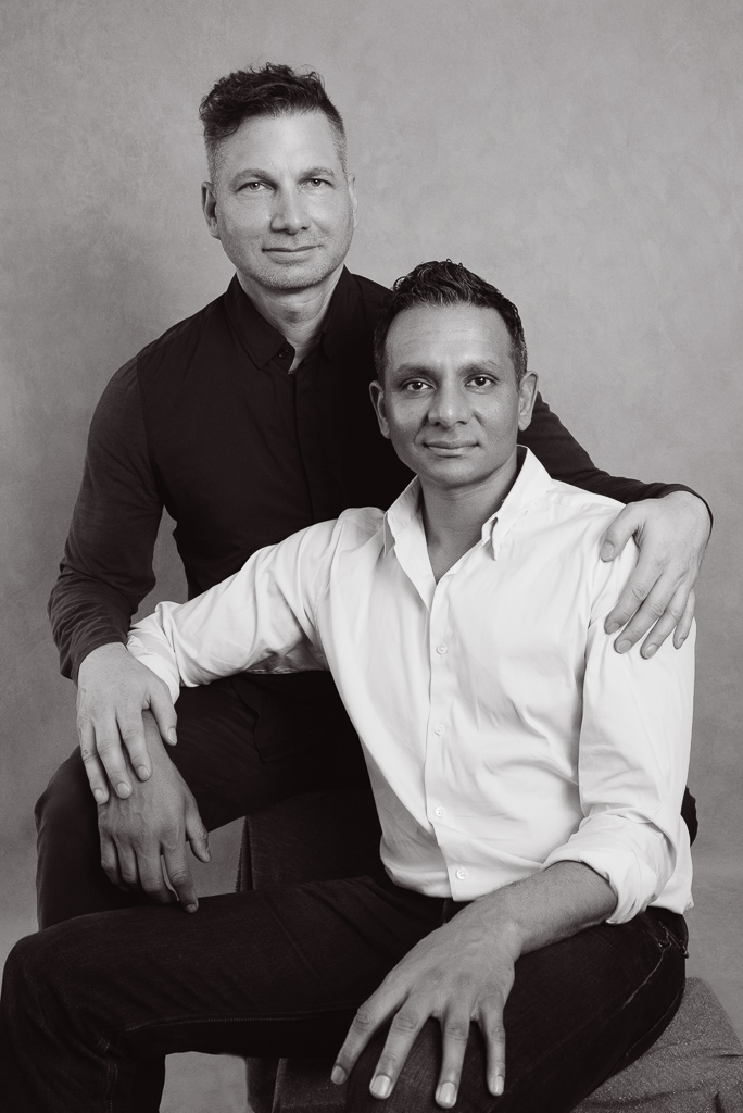 Black and white photo, two fathers posing at Gaby Clark Photography.