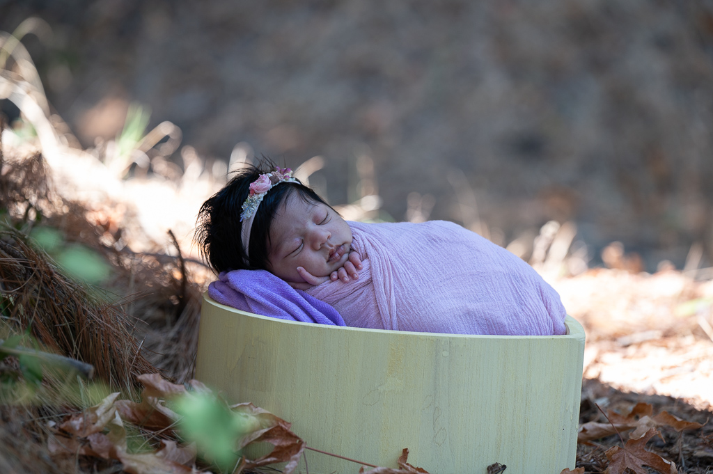 newborn baby girl outdoors before retouching