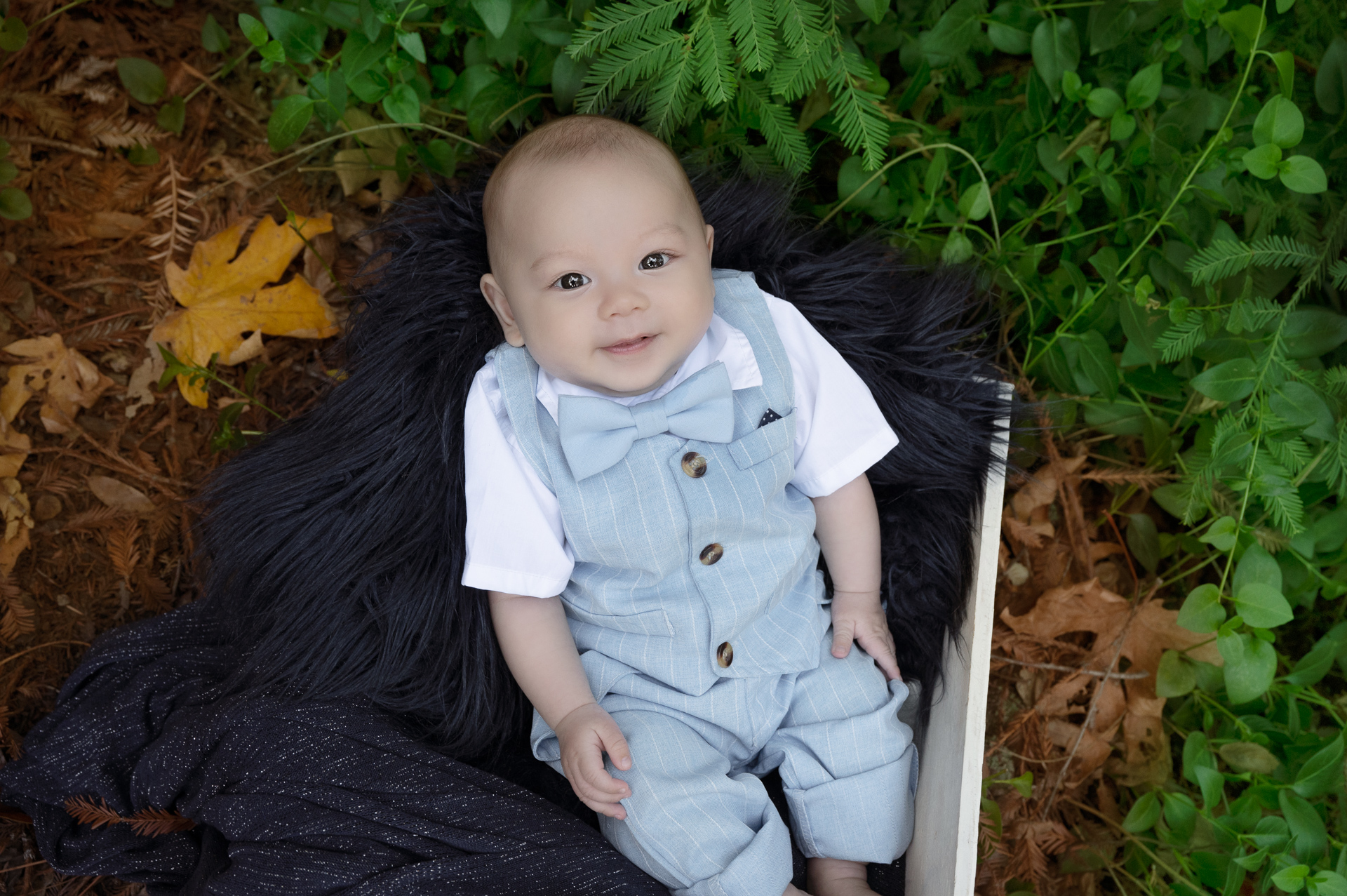baby boy wearing light blue suit outfit posing outdoors
